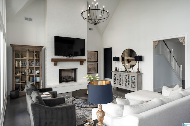 1904 Blackridge Rd, Hoover, AL 35244 - living area featuring high vaulted ceiling, a brick fireplace, a chandelier, and visible vents