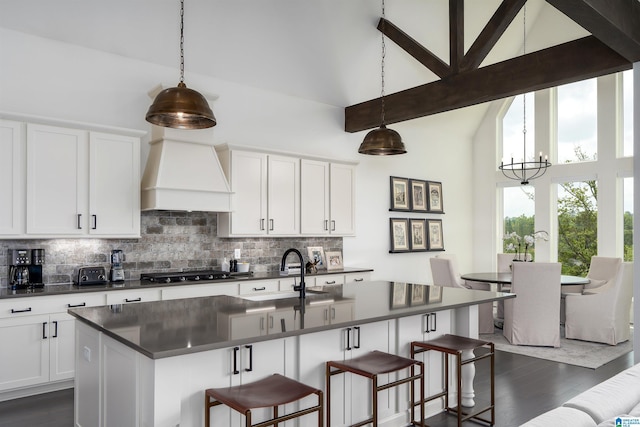 1904 Blackridge Rd, Hoover, AL 35244 - kitchen with a sink, backsplash, a chandelier, and dark countertops