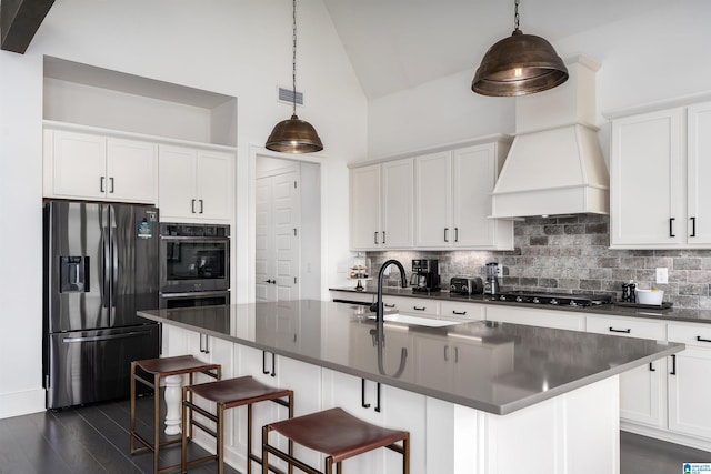 1904 Blackridge Rd, Hoover, AL 35244 - kitchen with black stovetop, refrigerator with ice dispenser, visible vents, and dark countertops