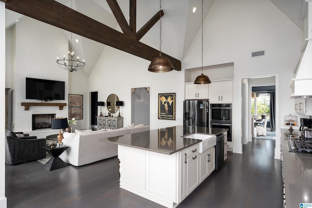 1904 Blackridge Rd, Hoover, AL 35244 - kitchen with dark countertops, a sink, high vaulted ceiling, freestanding refrigerator, and visible vents
