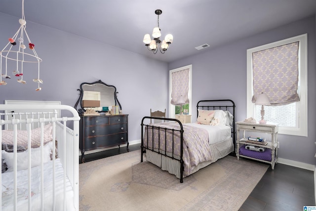 1904 Blackridge Rd, Hoover, AL 35244 - bedroom featuring visible vents, baseboards, wood finished floors, and a chandelier