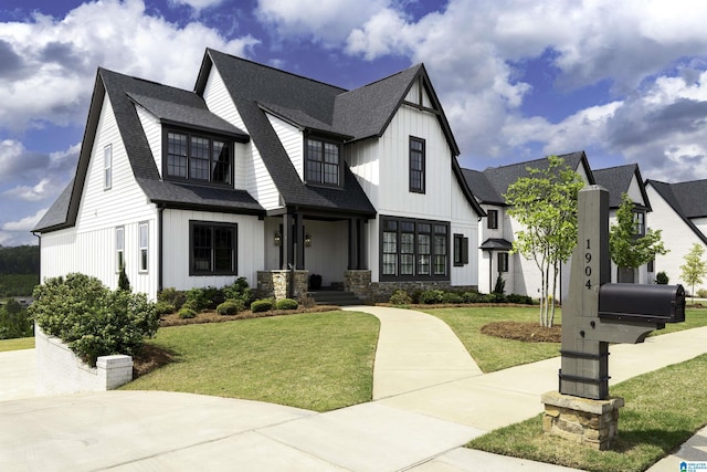 1904 Blackridge Rd, Hoover, AL 35244 - view of front of home featuring board and batten siding, a shingled roof, and a front yard