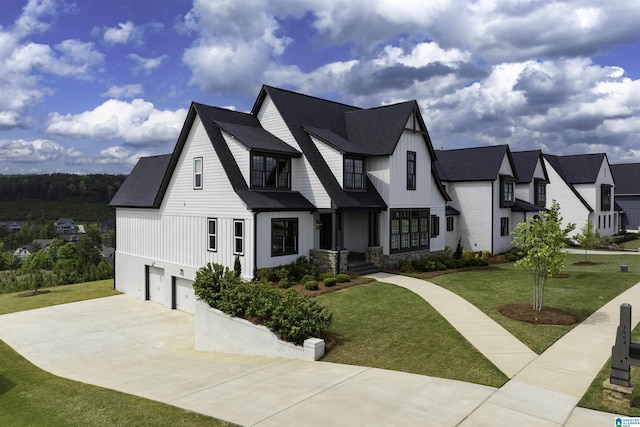 1904 Blackridge Rd, Hoover, AL 35244 - view of front of property with a front lawn, roof with shingles, board and batten siding, concrete driveway, and an attached garage