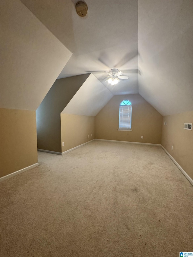 bonus room featuring vaulted ceiling, visible vents, and carpet