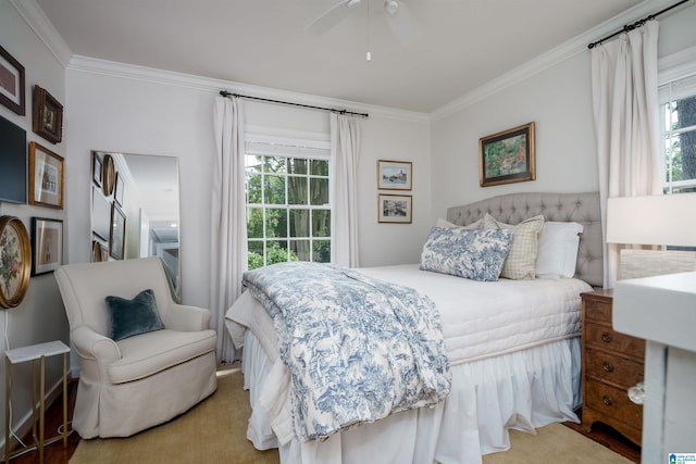 bedroom featuring ceiling fan and ornamental molding