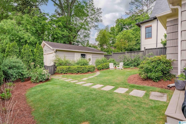 view of yard with an outdoor structure and fence