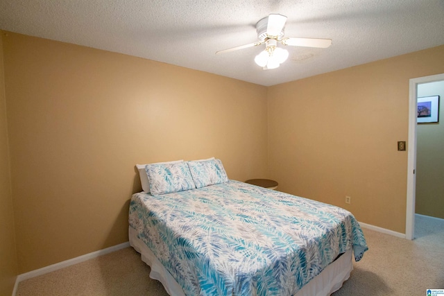 bedroom with carpet flooring, ceiling fan, and baseboards