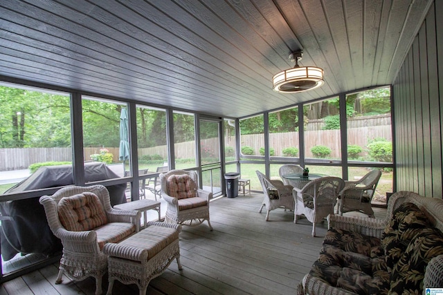 sunroom featuring outdoor dining area