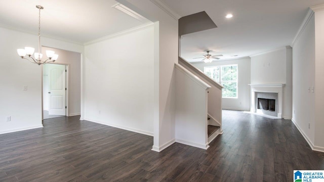 interior space with ceiling fan with notable chandelier, stairs, ornamental molding, and dark wood finished floors