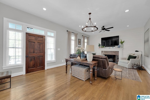 190 Drennen Park Cir, Hayden, AL 35079 - living area with a chandelier, light wood-type flooring, recessed lighting, a brick fireplace, and baseboards