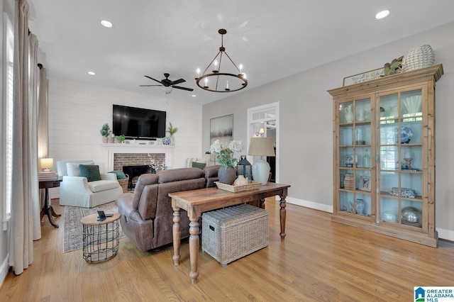 190 Drennen Park Cir, Hayden, AL 35079 - living room with light wood-style floors, a fireplace, a chandelier, baseboards, and recessed lighting