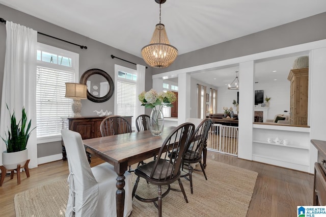 190 Drennen Park Cir, Hayden, AL 35079 - dining space featuring a chandelier, wood finished floors, and baseboards