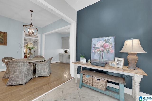 190 Drennen Park Cir, Hayden, AL 35079 - tiled dining space with a chandelier and baseboards