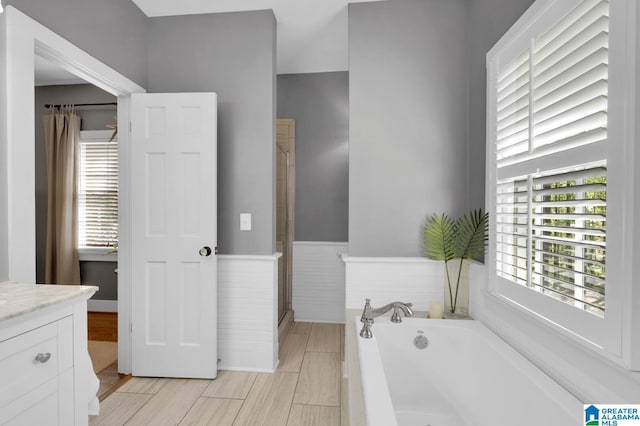 190 Drennen Park Cir, Hayden, AL 35079 - bathroom featuring a bath, healthy amount of natural light, vanity, and a stall shower