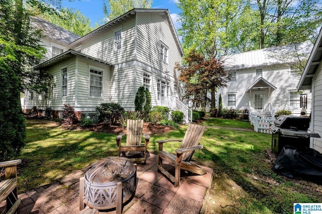 190 Drennen Park Cir, Hayden, AL 35079 - view of grassy yard with a fire pit, a patio, and stairs