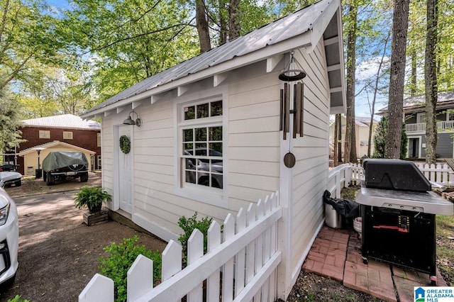 190 Drennen Park Cir, Hayden, AL 35079 - view of property exterior with an outdoor structure and metal roof