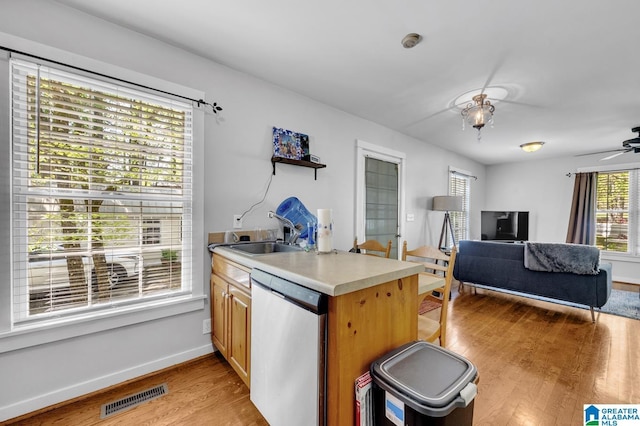 190 Drennen Park Cir, Hayden, AL 35079 - kitchen with dishwasher, light wood-type flooring, a sink, baseboards, and ceiling fan