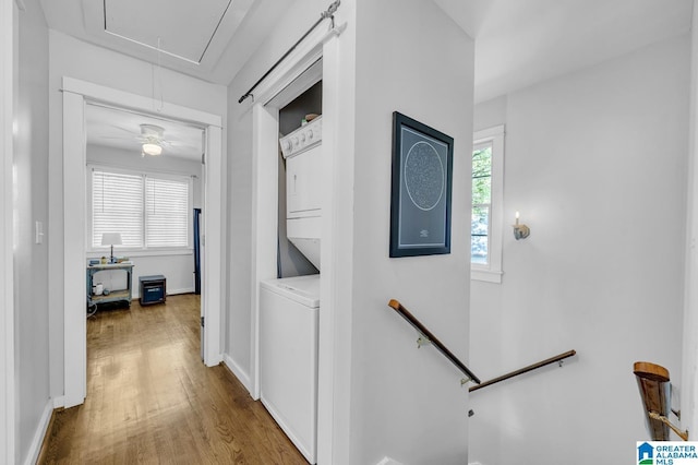 190 Drennen Park Cir, Hayden, AL 35079 - corridor with attic access, stacked washer / dryer, wood finished floors, baseboards, and an upstairs landing