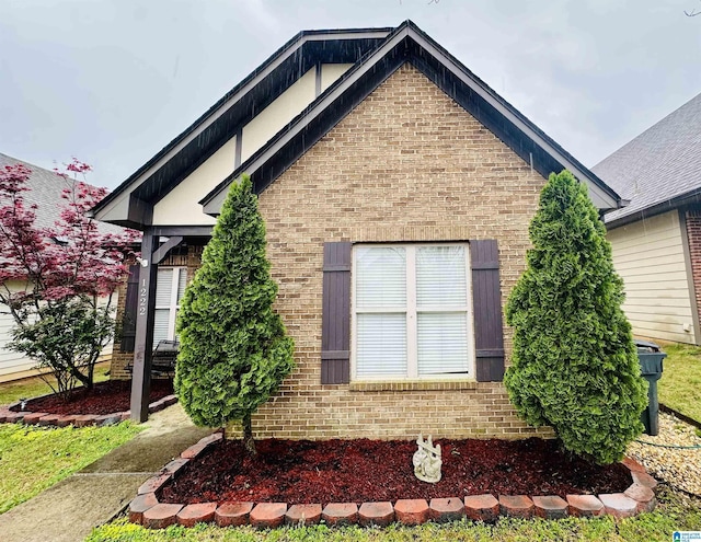 exterior space featuring brick siding