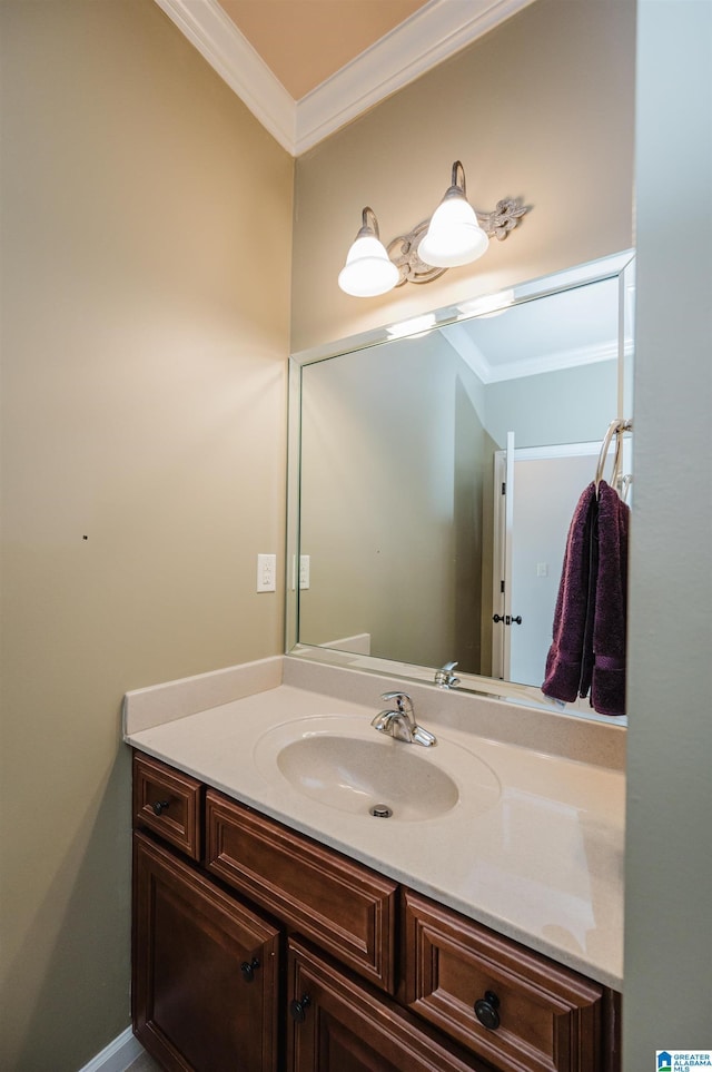 bathroom with vanity and ornamental molding