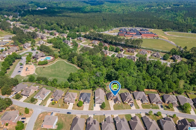 aerial view featuring a view of trees and a residential view
