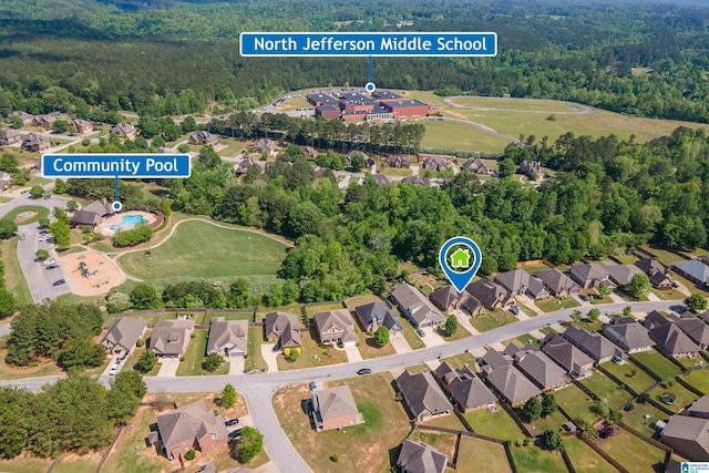 bird's eye view featuring a view of trees and a residential view