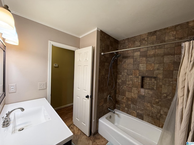 bathroom featuring vanity, ornamental molding, and shower / tub combo