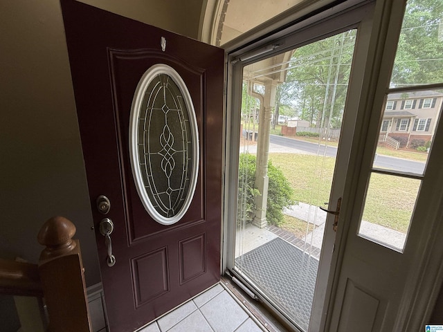 entryway featuring light tile patterned flooring