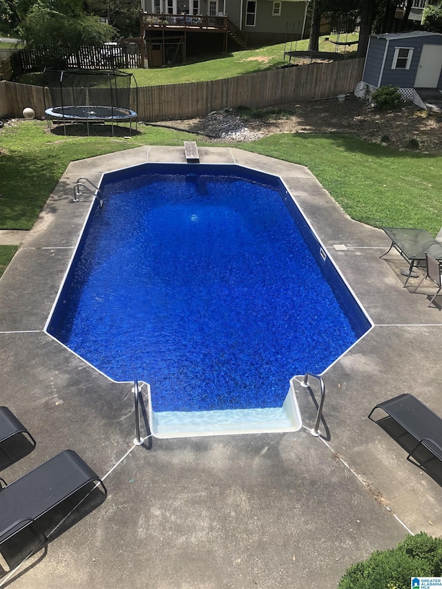 96 Tomahawk Cir, Pelham, AL 35124 - view of swimming pool featuring a trampoline, a shed, a fenced backyard, and a patio