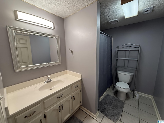 bathroom with tile patterned flooring, toilet, a textured ceiling, and visible vents