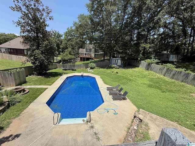 96 Tomahawk Cir, Pelham, AL 35124 - view of swimming pool with a storage unit, a fenced backyard, and a patio area