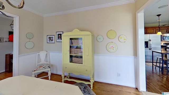 214 Scotts Trce, Helena, AL 35022 - bedroom with crown molding, wainscoting, wood finished floors, and stainless steel fridge with ice dispenser