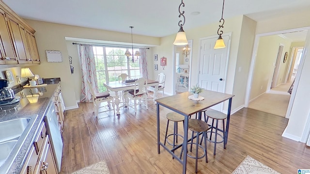 214 Scotts Trce, Helena, AL 35022 - dining space featuring baseboards, light wood-type flooring, and a chandelier