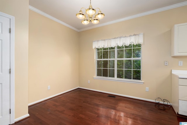 unfurnished dining area featuring a chandelier, crown molding, visible vents, baseboards, and wood finished floors