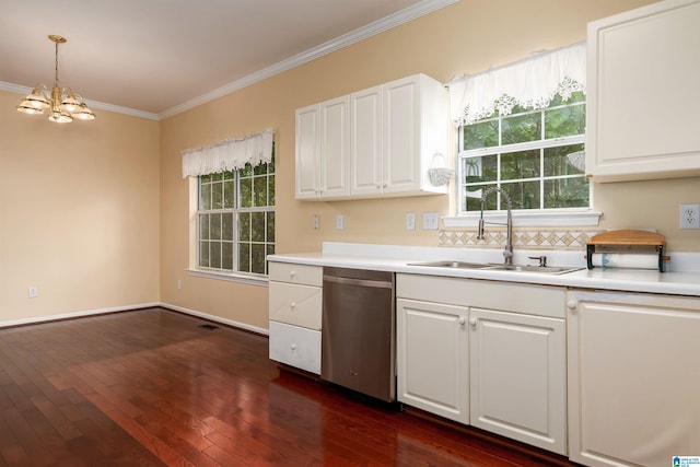 kitchen featuring stainless steel dishwasher, white cabinets, crown molding, a sink, and a chandelier