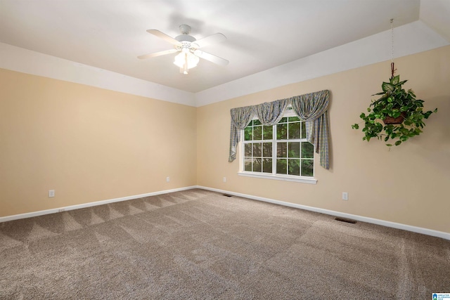 unfurnished room with ceiling fan, carpet floors, and baseboards