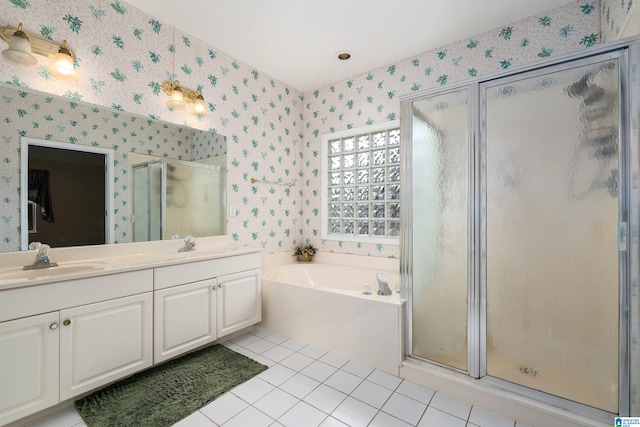 bathroom with a sink, a shower stall, a garden tub, tile patterned flooring, and wallpapered walls