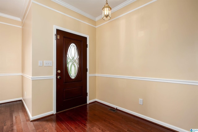 foyer entrance with baseboards, ornamental molding, and dark wood-style floors