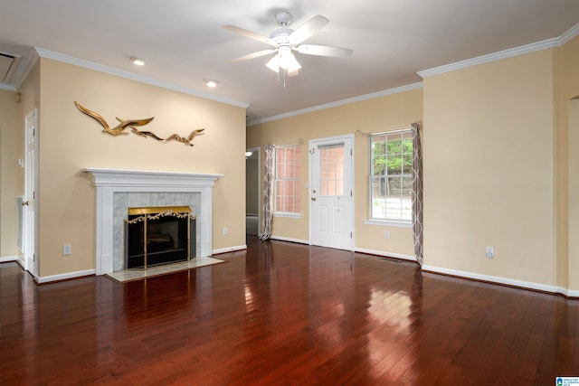 unfurnished living room featuring wood-type flooring, a ceiling fan, a high end fireplace, and baseboards