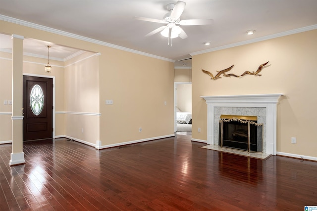 unfurnished living room with wood-type flooring, a ceiling fan, and baseboards
