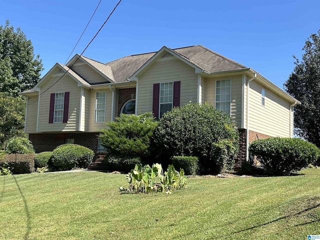 41 Woodland Ridge Rd, Odenville, AL 35120 - view of front of house with a front lawn, a shingled roof, and brick siding