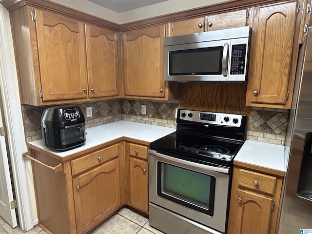 41 Woodland Ridge Rd, Odenville, AL 35120 - kitchen with appliances with stainless steel finishes, tasteful backsplash, and light countertops