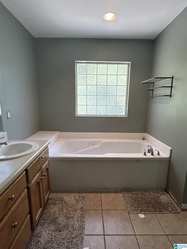41 Woodland Ridge Rd, Odenville, AL 35120 - bathroom featuring a garden tub, tile patterned floors, and vanity