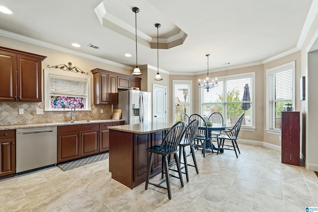 kitchen with visible vents, stainless steel appliances, plenty of natural light, and a sink