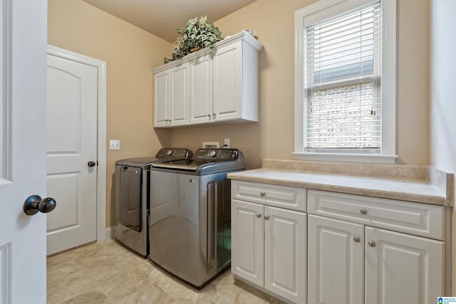 laundry area with cabinet space and washing machine and dryer