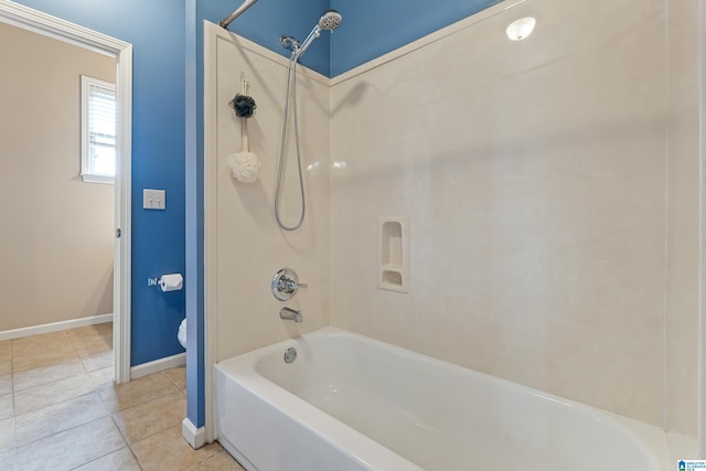 bathroom with baseboards, toilet, tile patterned flooring, and  shower combination