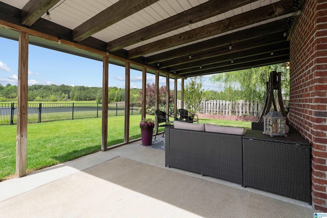view of patio featuring outdoor lounge area and fence