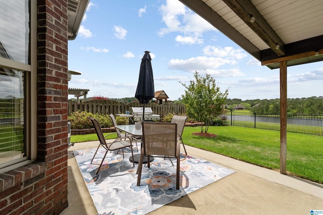 view of patio / terrace with outdoor dining space and a fenced backyard