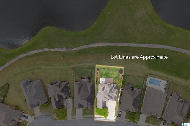 birds eye view of property with a residential view