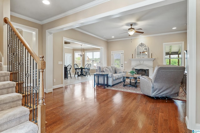 living room with recessed lighting, wood finished floors, a ceiling fan, and stairs
